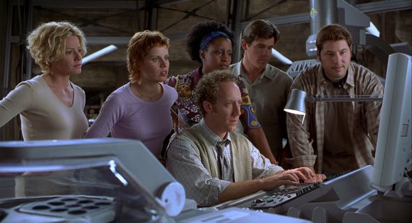 6 person looking at one singular computer screen, trying to work on it